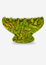Green glass menorah on a white background