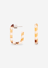 A pair of U-shaped hoop earrings with a striped pattern in orange, yellow, and white, shown on a light gray background.