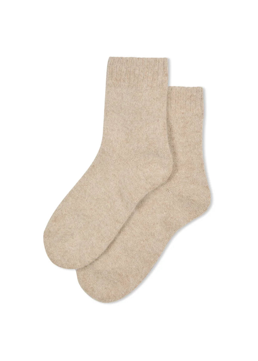 Gray socks with brown accents on a light gray background