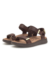 Pair of brown sandals with gold accents on a white background