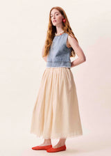 Long pleated skirt with elasticated waist in a pinkish beige colour.