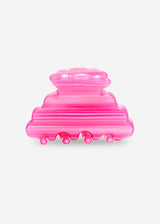 Pink plastic tool on a white background