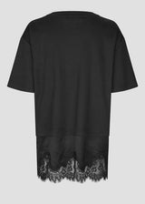 A black short-sleeve top with a sheer black lace hem, shown from the back against a light gray background.