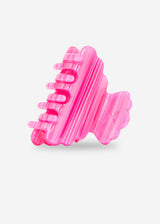Pink textured object on a light gray background