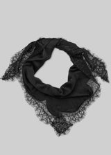 A black square scarf featuring a satin center and intricate lace trim, arranged in a loop on a solid gray background.